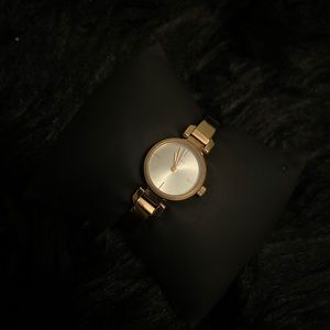 Used/excellent condition-beautiful DKNY gold rose